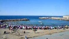 Beach town bans men's too-short swim trunks, sparking debate and rule flipflop