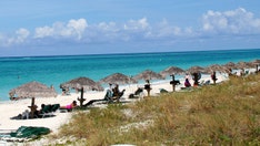 Mystery deepens as body discovered during search for missing American in island paradise