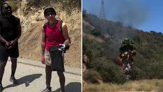 Californians confront man accused of starting LA fire until police make arrest