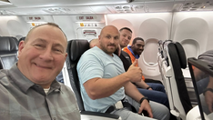 Smiling fugitive recaptured and returned to Kentucky after dramatic airport escape