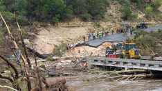 Police say 'sightseers' hindering Texas recovery efforts as teams search for victims in debris