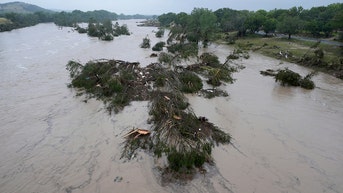 Woman swept 20 miles downstream found screaming for help as death toll climbs - Fox News