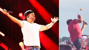 Luke Bryan gets hit in the face by object thrown on stage during concert