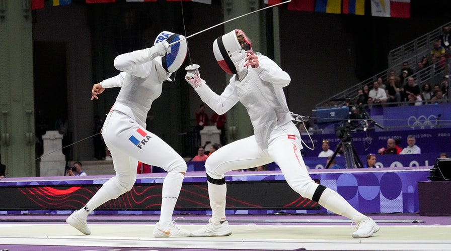 Women's fencer Stephanie Turner reacts to Team USA following Trump's order to protect women's sports