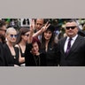 Sharon Osbourne and children crying at Ozzy Osbourne's funeral.