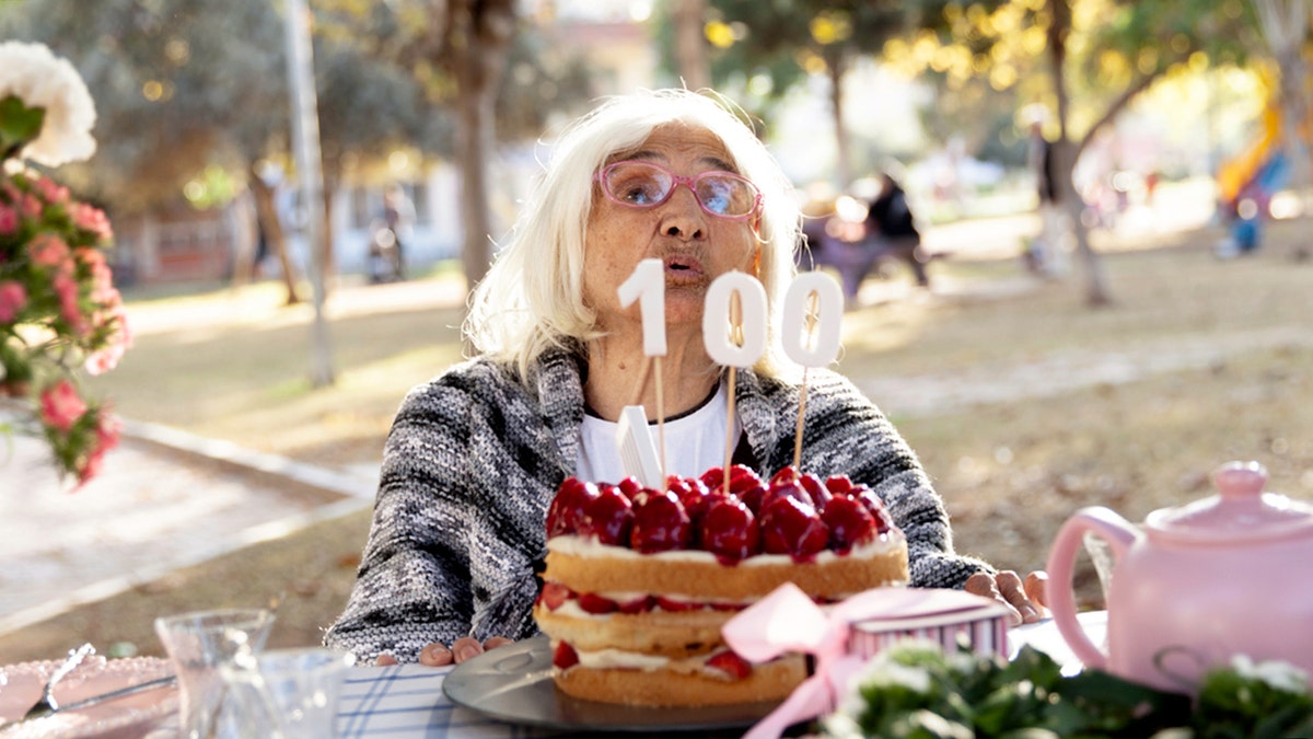 woman celebrates 100th Birthday in a park