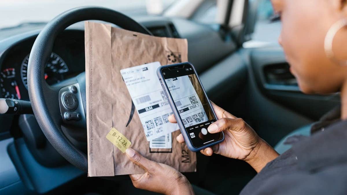 Scanning a QR code on a package with a phone.