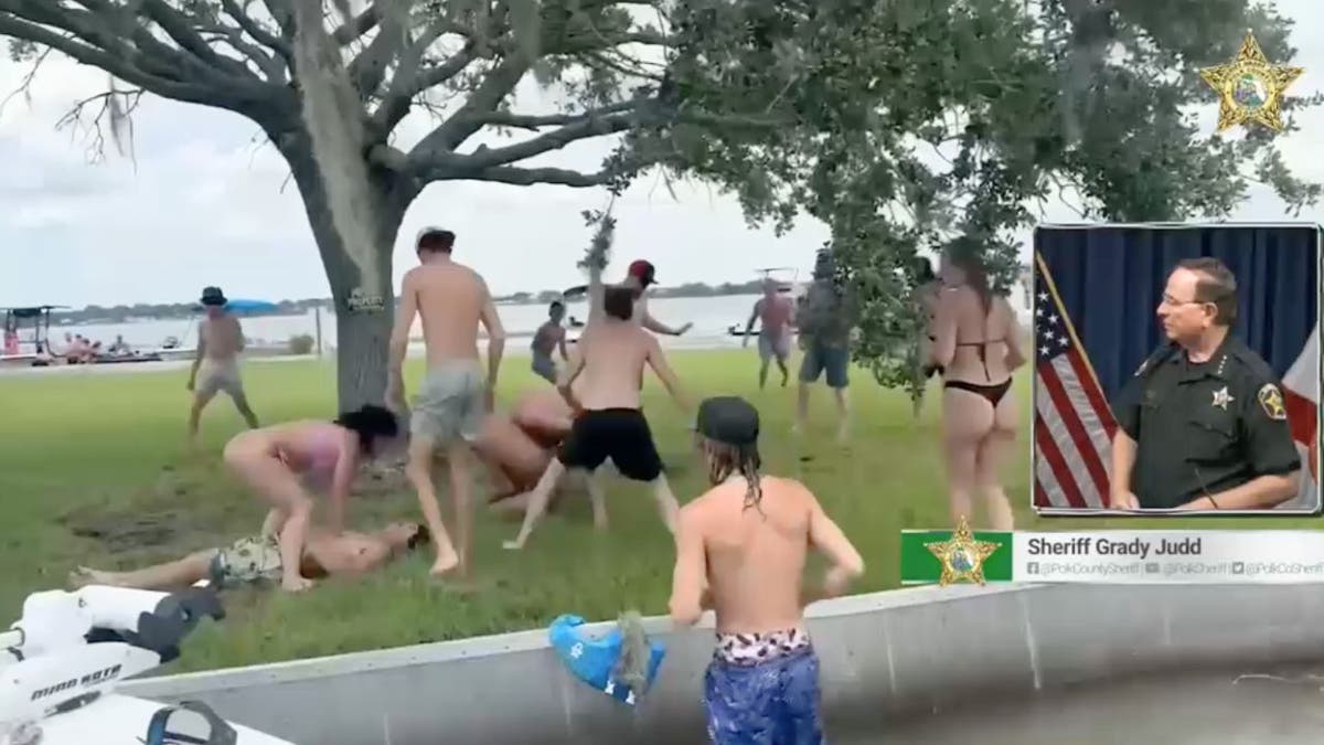 A woman performs cpr on a man