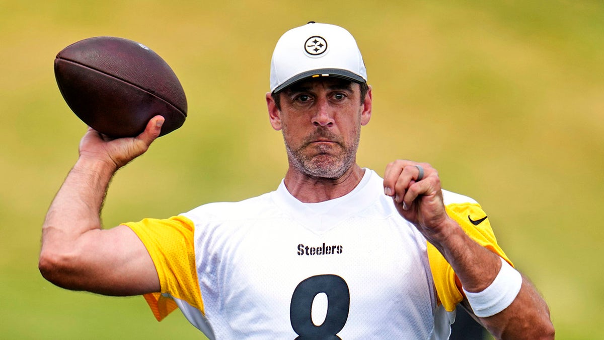 Aaron Rodgers throws football