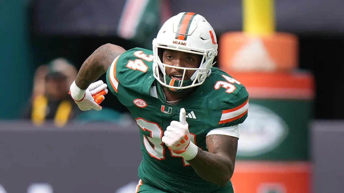 Adarius Hayes runs to cover a kick during a football game.