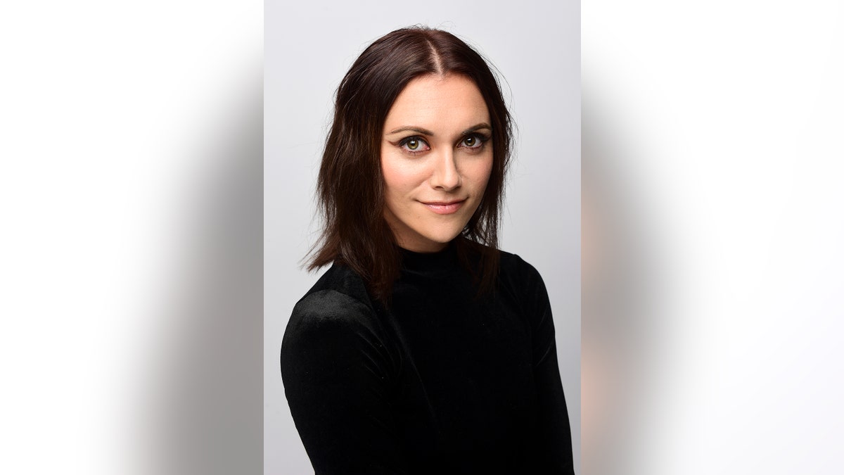 Alyson Stoner wearing a black turtleneck at an IMDB event in California.