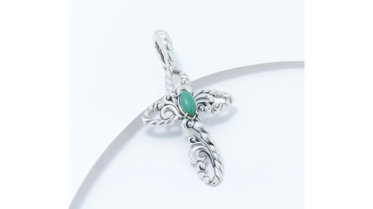 This pendant is enhanced with a beautiful gemstone.
