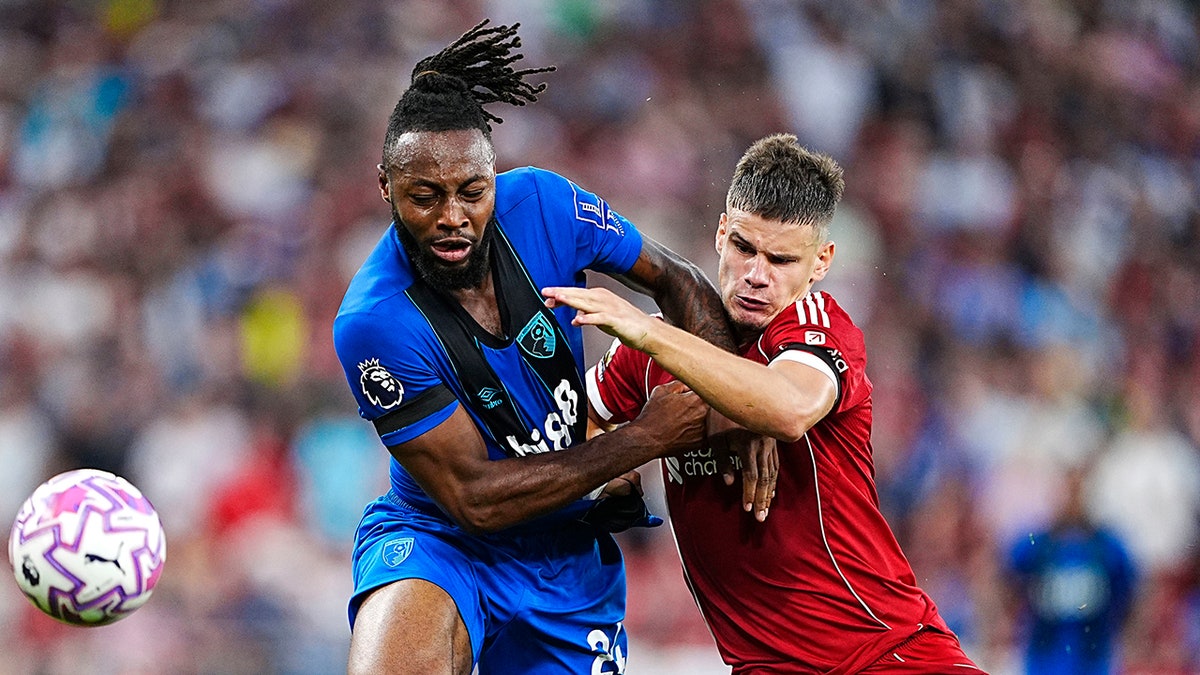Antoine Semenyo fights for ball