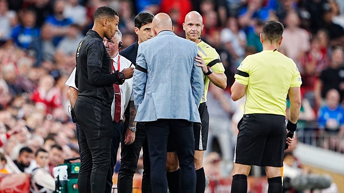 Referee speaks to coaches