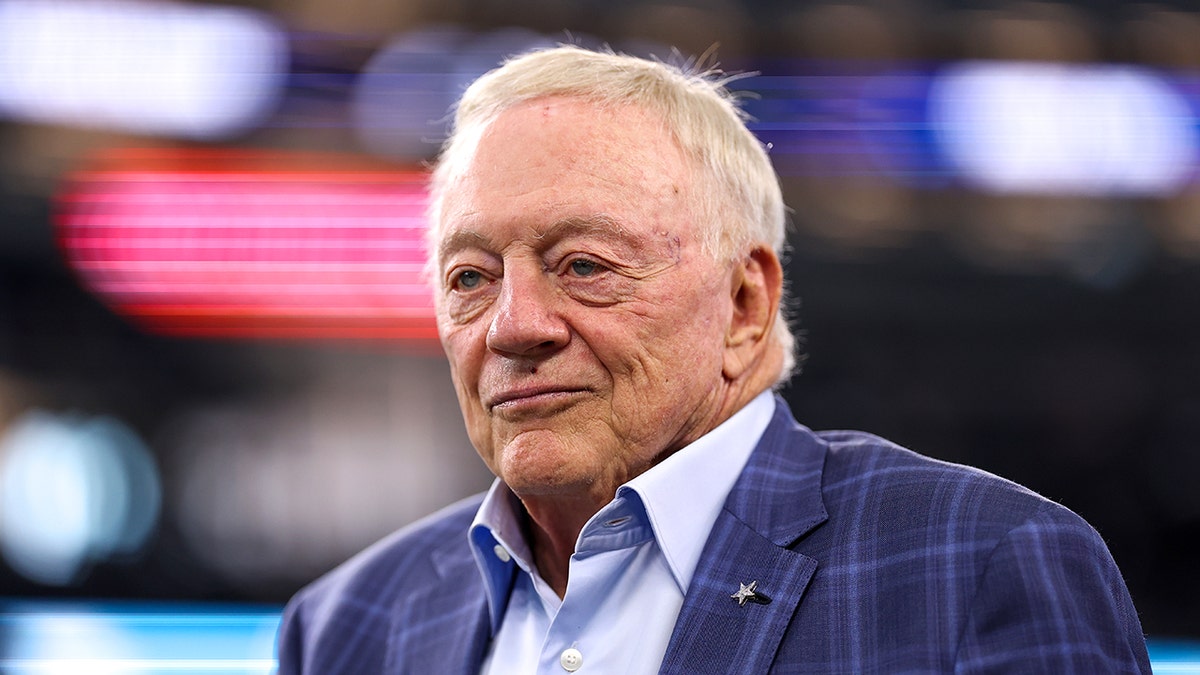 Jerry Jones looks on field
