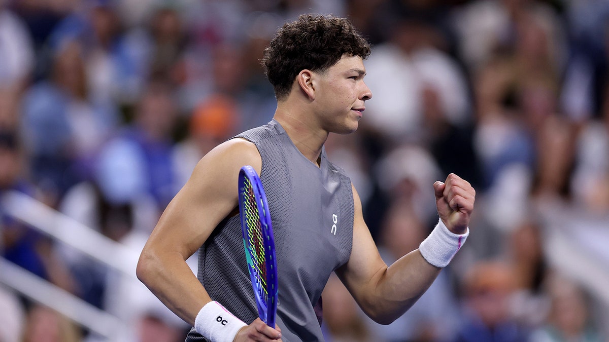 Ben Shelton reacts during a tennis match
