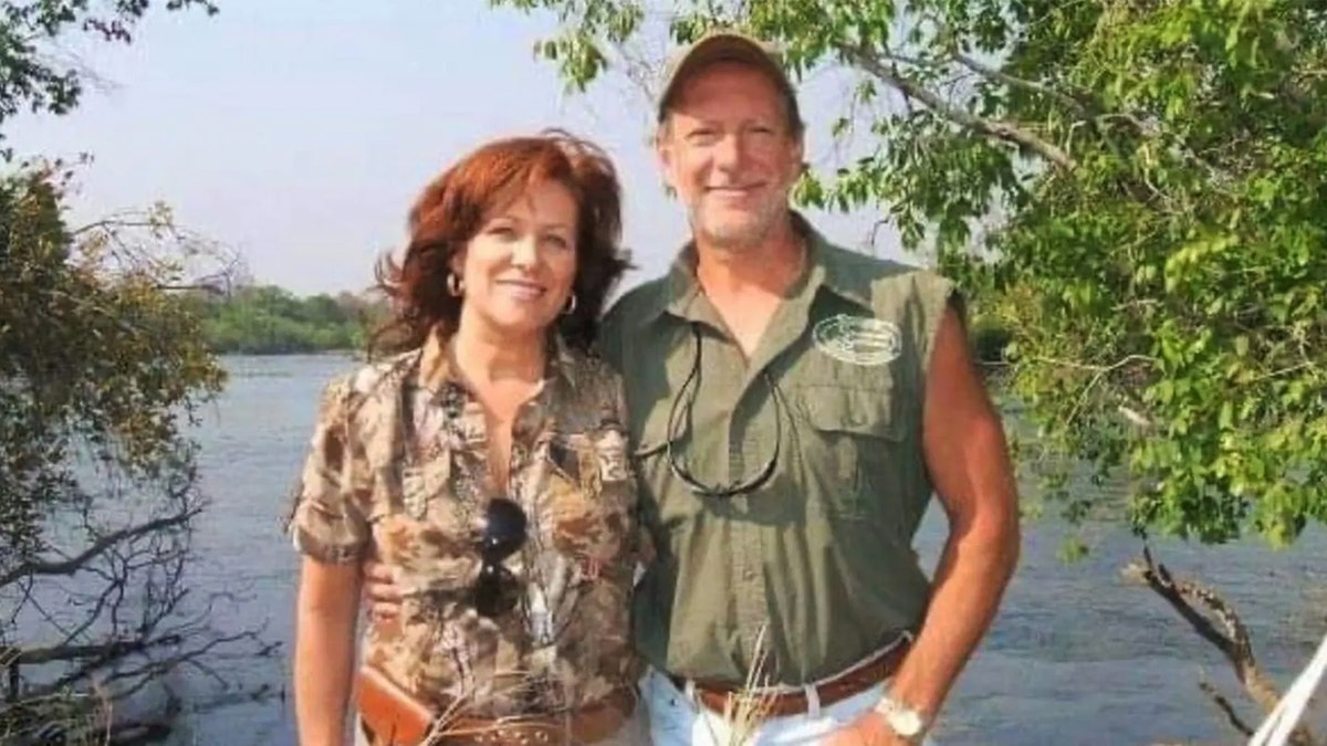 Bianca Rudolph and Larry Rudolph smiling in safari wear outdoors in Africa.