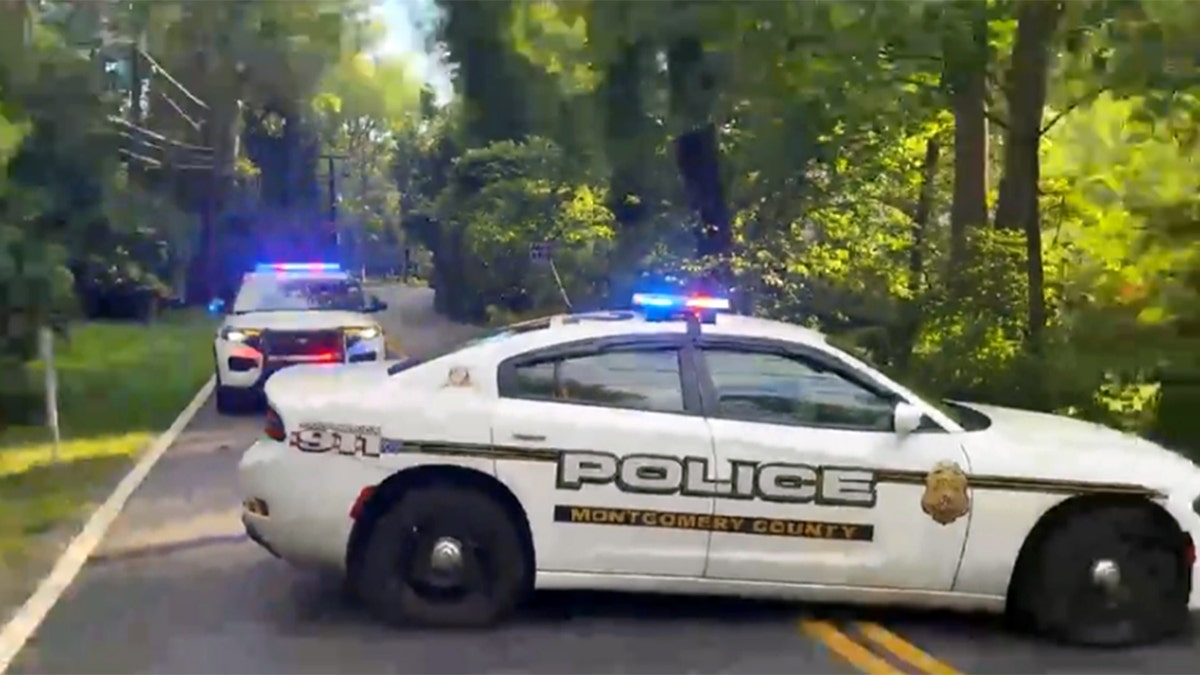 Montgomery County police block a road near John Bolton’s Maryland home during an FBI operation, Aug. 22, 2025.