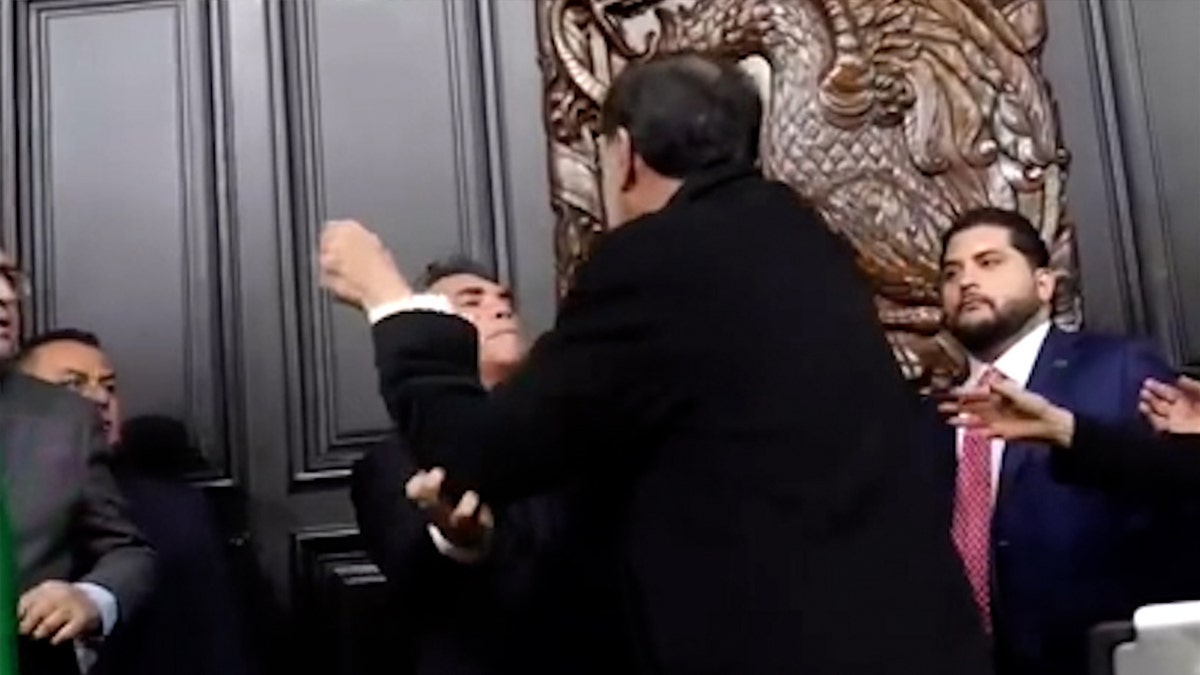 two politicians exchanging blows