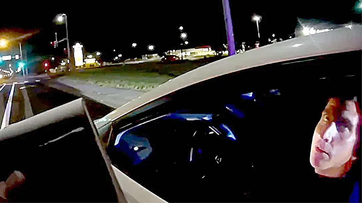 Kohberger looks at a deputy from the driver side of his white Hyundai Elantra during a traffic stop on bodycam video
