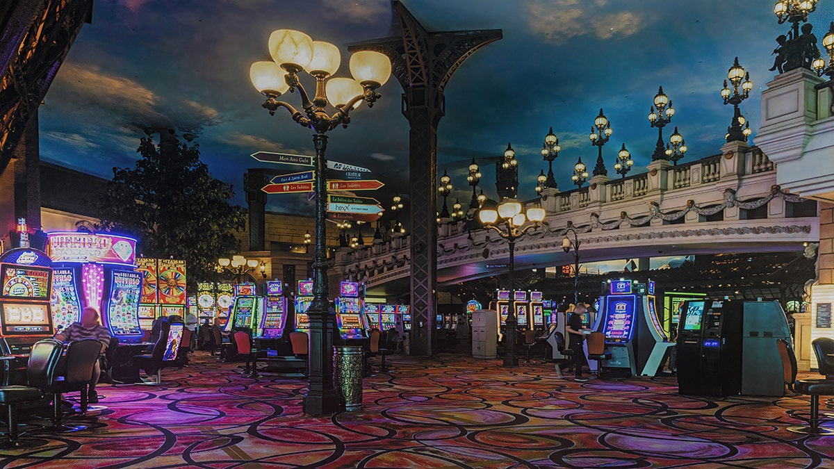 Casino Paris in Las Vegas interior of casino with game tables, slot machines, roulette, few people seen.