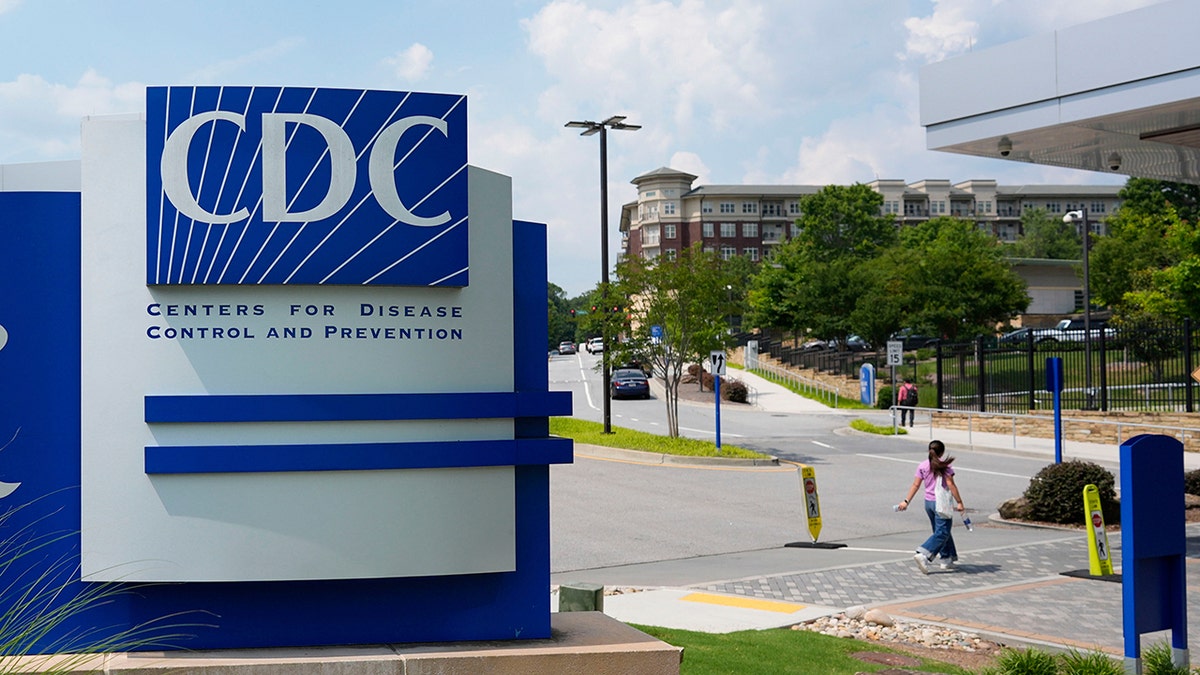 People walk outside the CDC campus in Atlanta