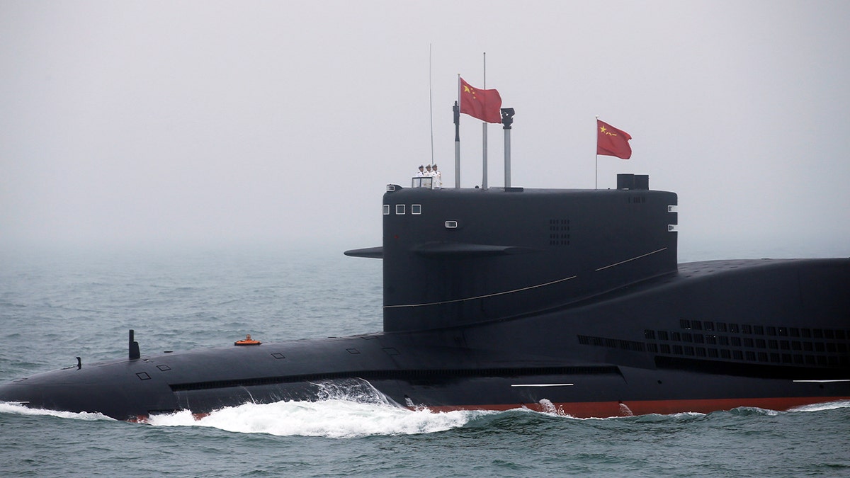 Chinese Navy's Power Sucleary-Powered Suclearry March 11 participated in the Naval Parade off in the Oriental Qingdao City.