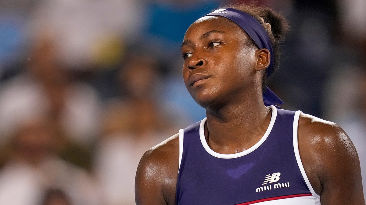 Coco Gauff looks on tennis court