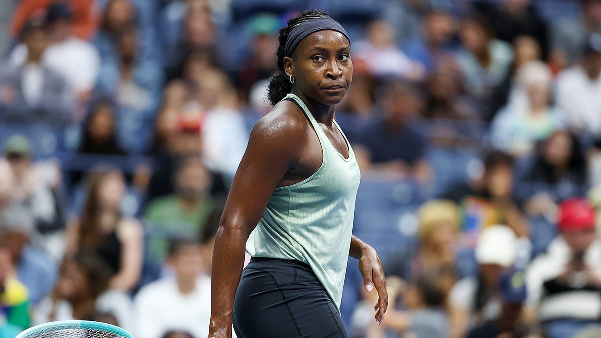 Coco Gauff looks on tennis court