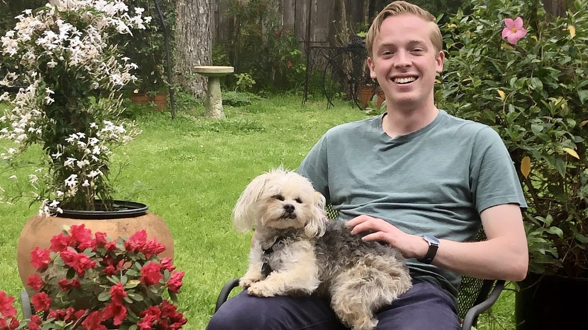 Guilford Cole Henderson pictured with a dog