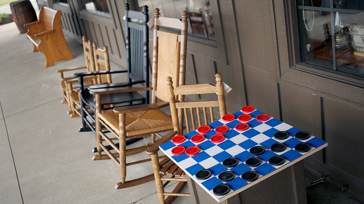 Customers of beloved Cracker Barrel slam the restaurant remodels on social media 2 Rocking chairs and a checkers board are for sale outside a Cracker Barrel Old Country Store restaurant.