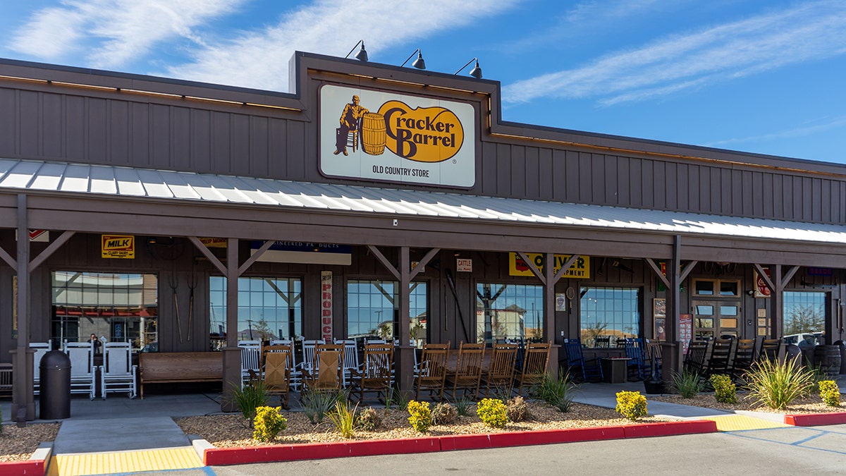 Customers of beloved Cracker Barrel slam the restaurant remodels on social media 3 The exterior of a Cracker Barrel Old Country Store with rocking chairs outside is shown.