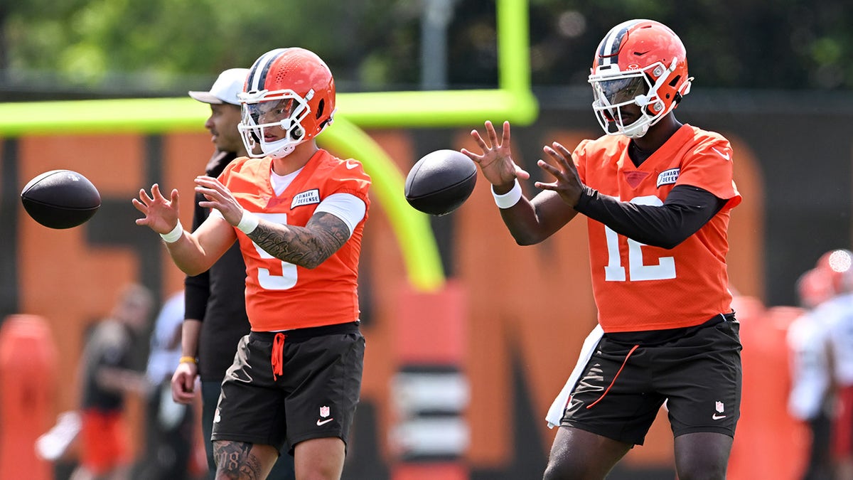 Dillon Gabriel and Shedeur Sanders go through practice drills