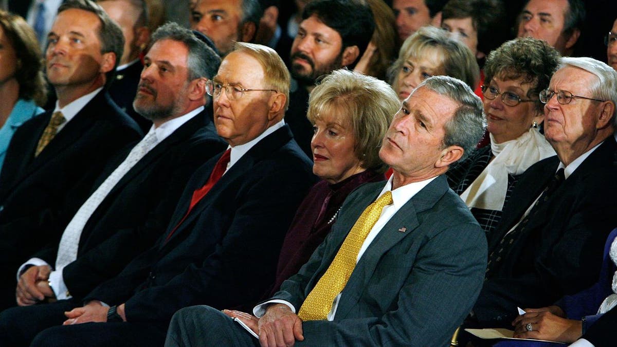 Former President George W. Bush seated with Dr. James Dobson, founder of Focus on the Family, Rabbi Michael Siegel and minister Mike Fechner.