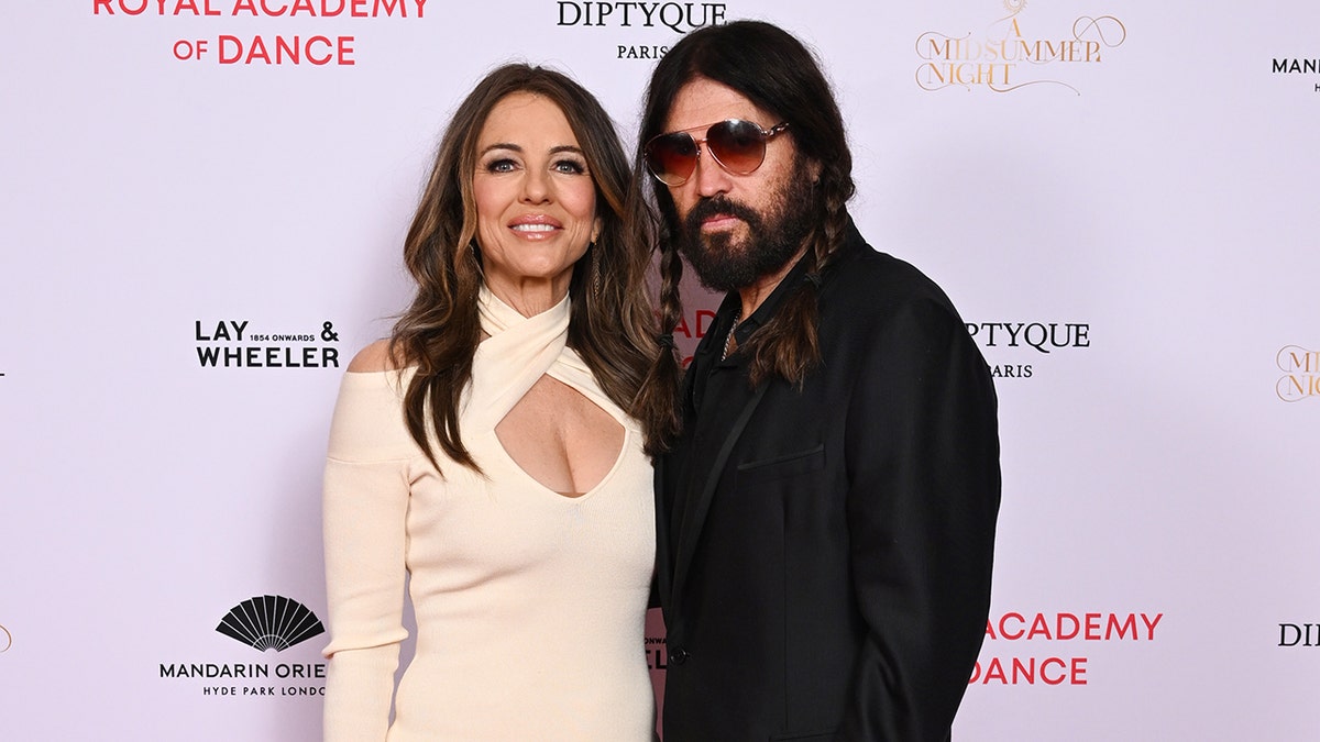 Elizabeth Hurley and Billy Ray Cyrus at the Royal Academy of Dance fundraiser in June 2025.