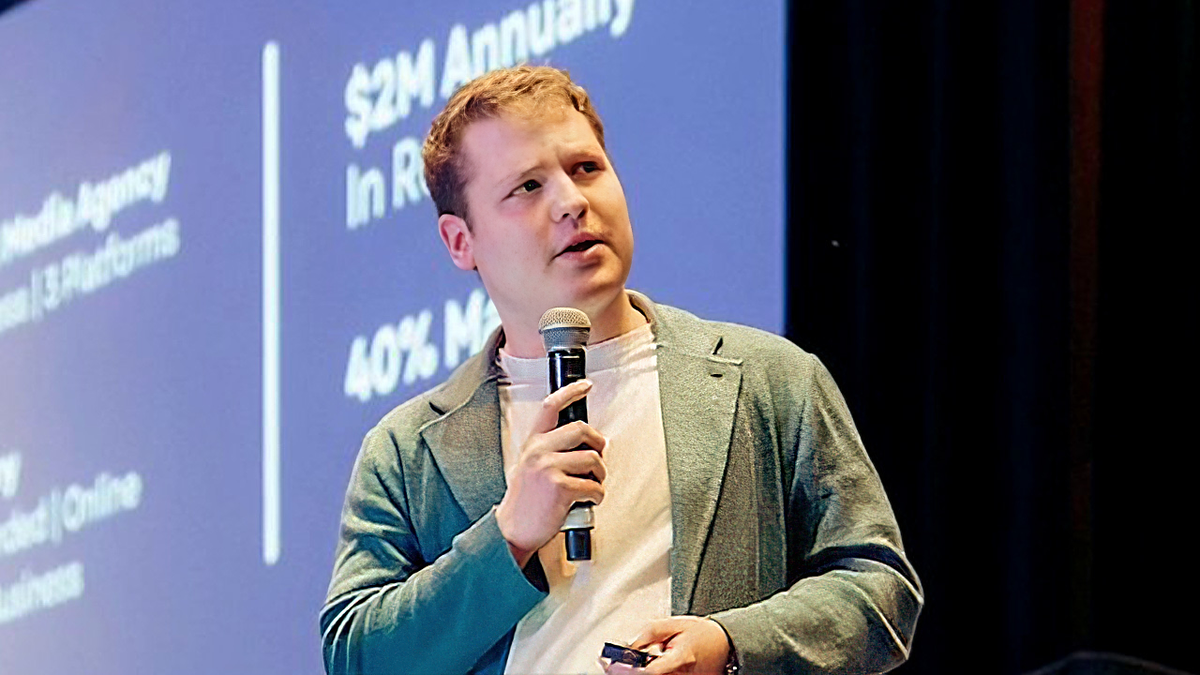 Gen Z CEO Emil Barr speaks before an audience on stage