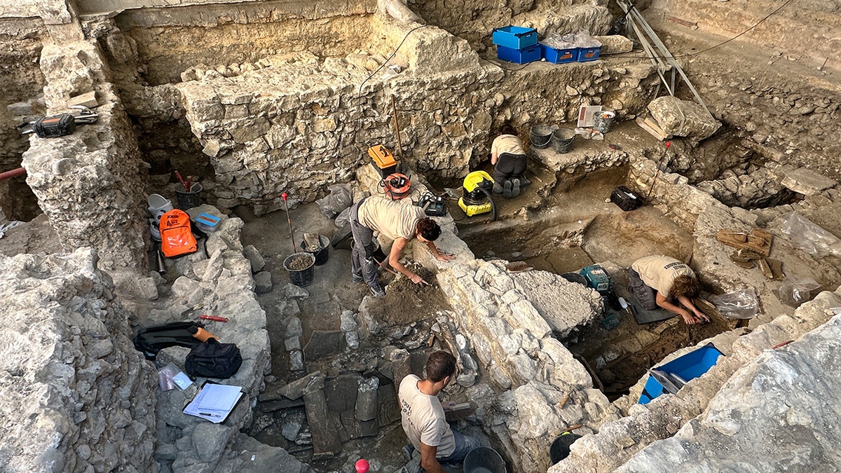 Archaeologists excavating cathedral area