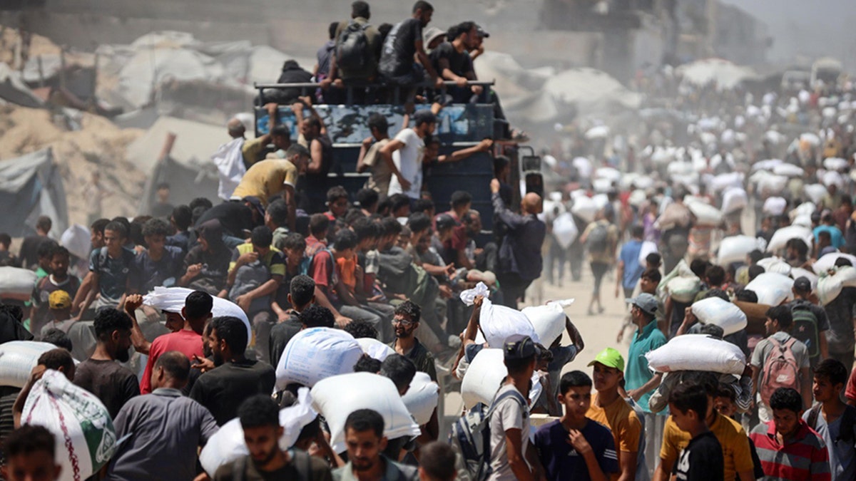 Gazans wear food drops by Jordan and the United Arab Emirates in July. 27