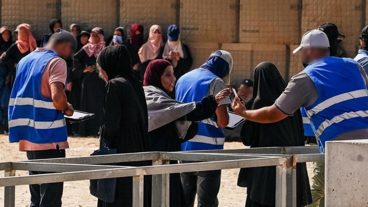 Gazan woman interact with U.S.-backed aid group