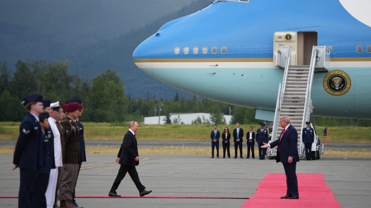 President Trump and Russian President Vladimir Putin greet each other in Alaska.