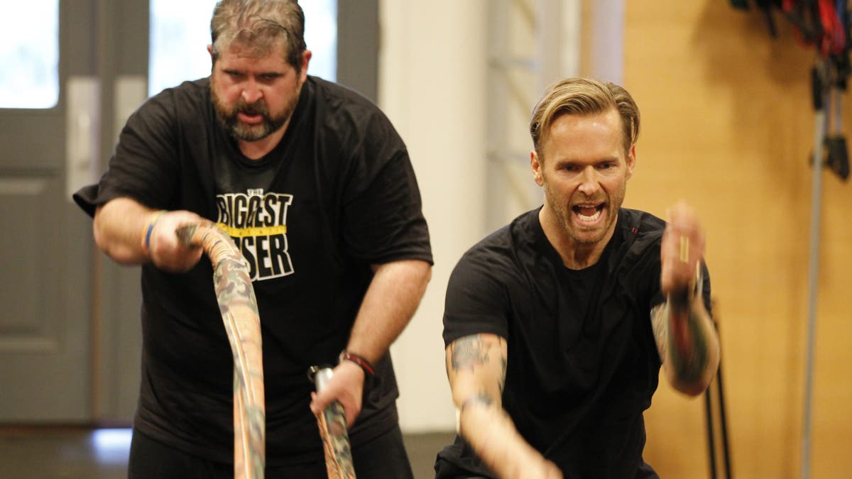 Bob Harper instructing a contestant on The Biggest Loser. 