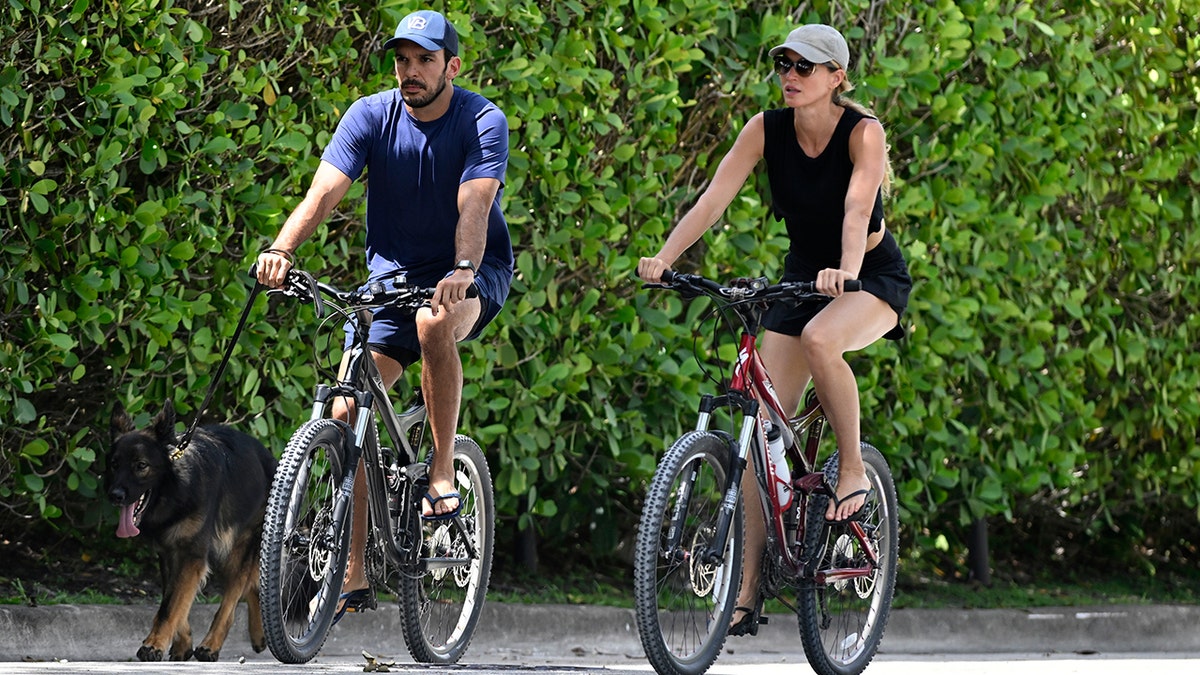Gisele Bundchen and Joaquim Valente on bikes in Florida