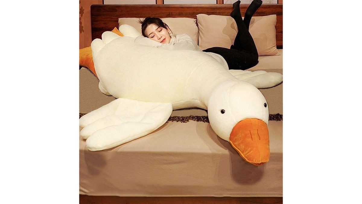 Snuggle up with this plush that doubles as a body pillow.
