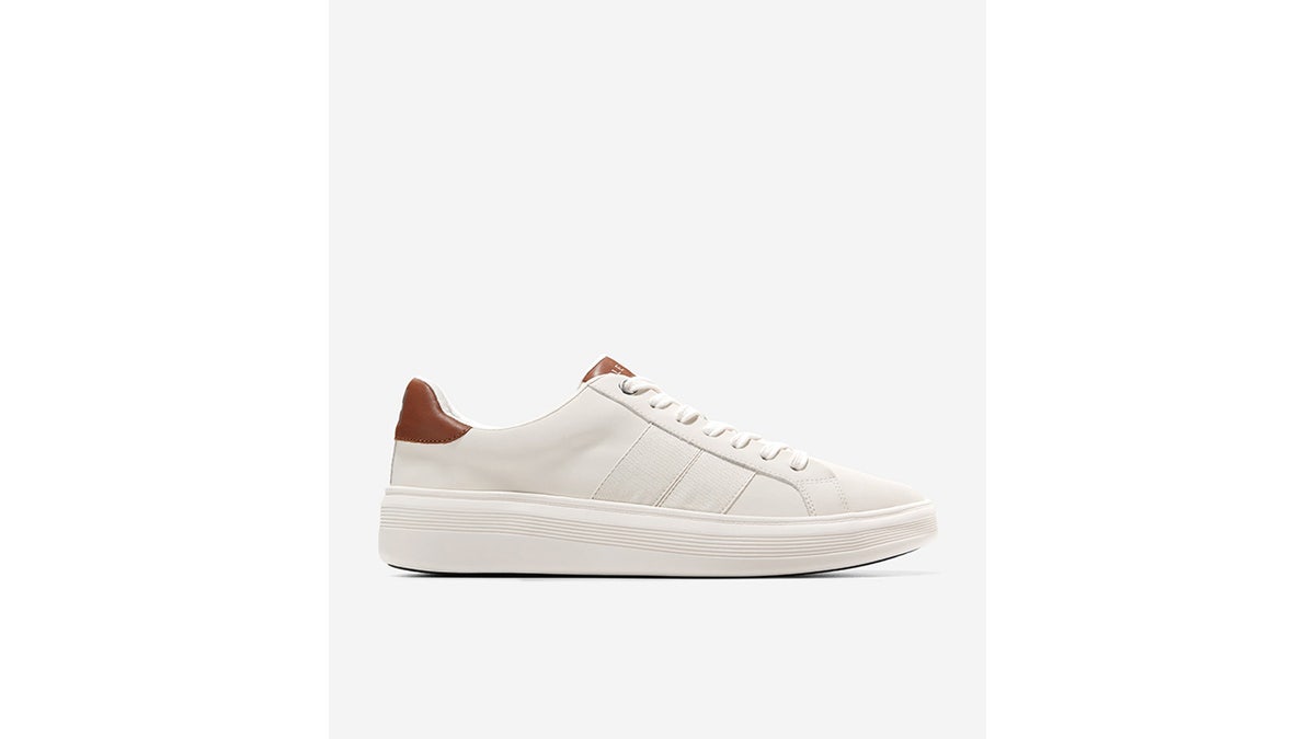 This shoe has a sleek, low-profile silhouette with a clean, classic tennis shoe-inspired design.
