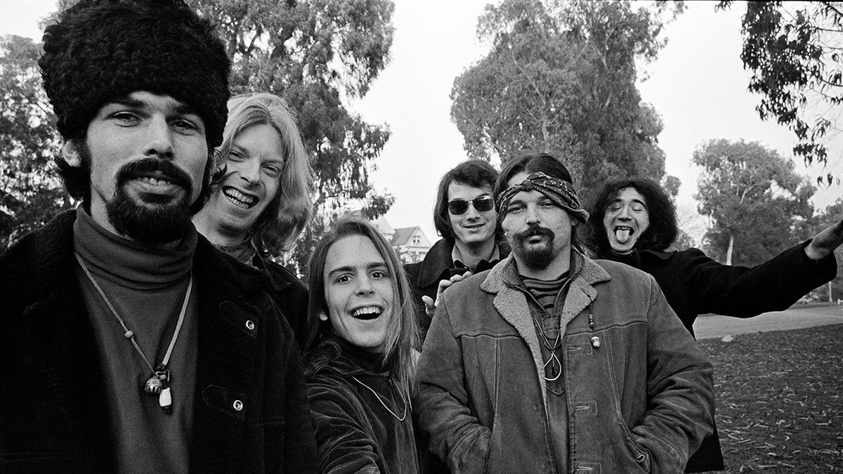 The Grateful Dead looking at Jim Marshall's camera and laughing in San Francisco.