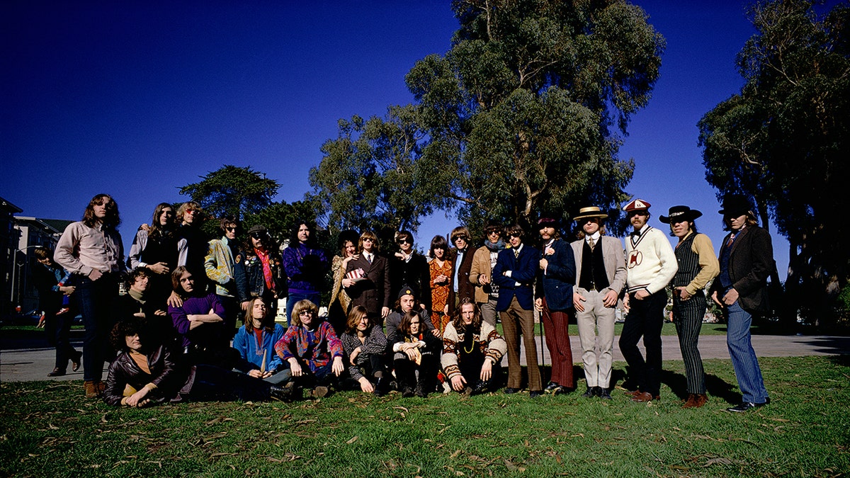 A group of musicians posing outdoors in San Francisco during the 1960s.