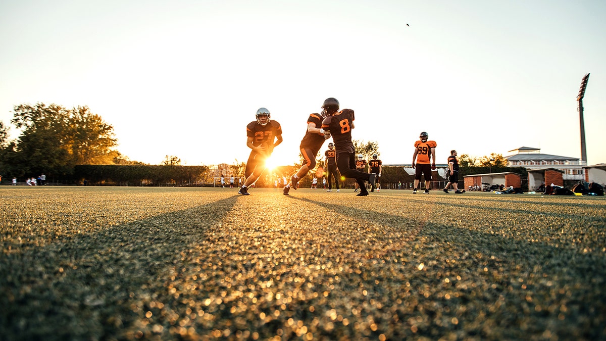 People playing football in the heat