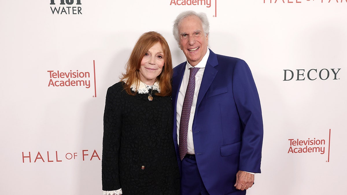 Henry Winkler with his wife on the Hall of Fame red carpet