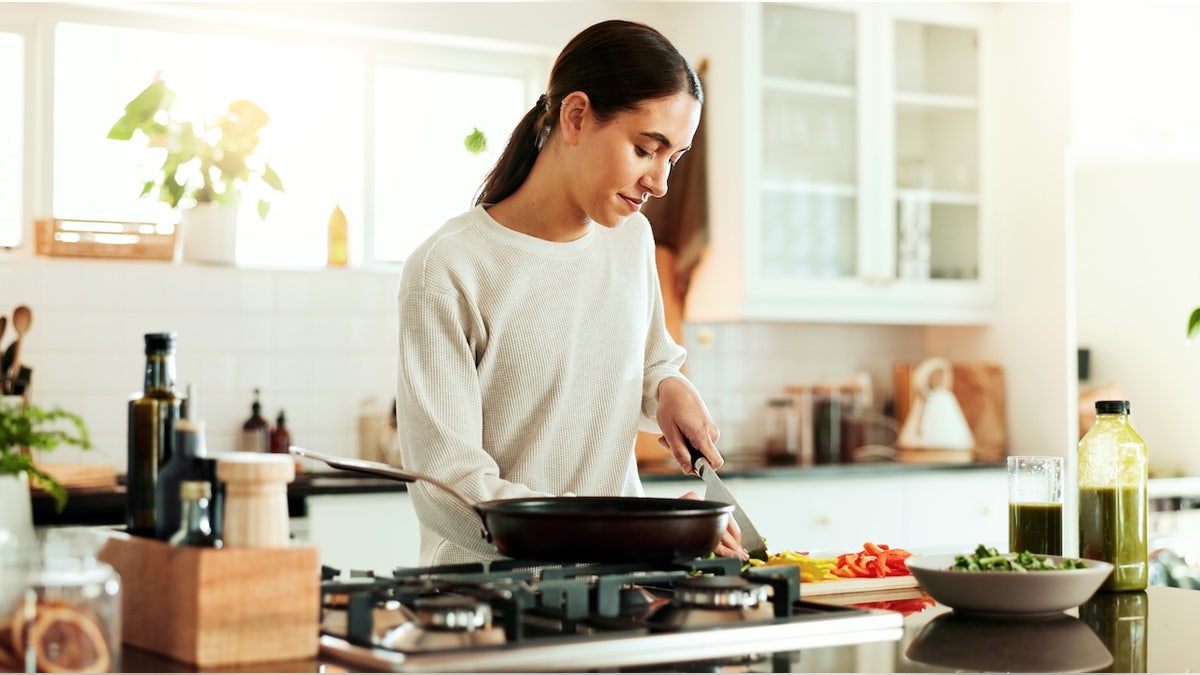 istock-woman-cooking-2177245586 Easy back-to-school meals with this hexclosed pan and easy recipes