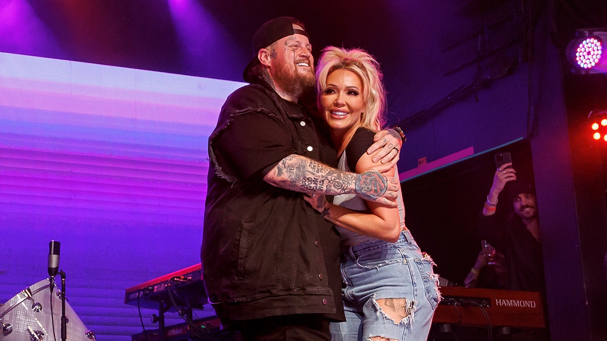 Jelly Roll and Bunnie Xo on stage at the Jelly Roll & Friends concert in May 2025.